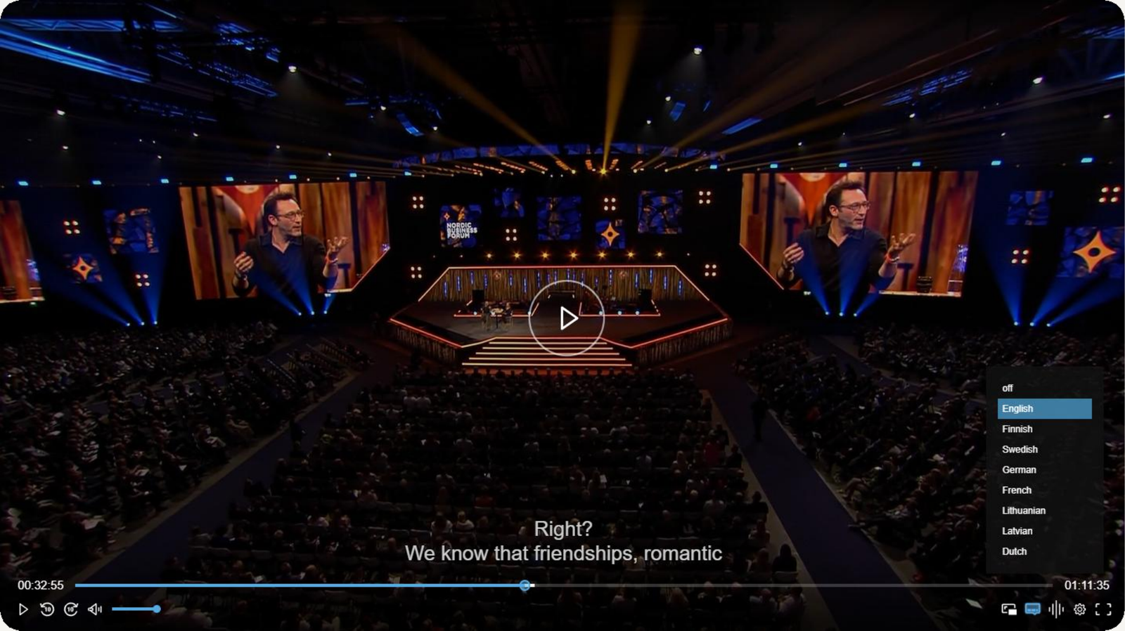 A conference broadcast in the Videosync player with the language menu open, listing eight languages a viewer can switch between
